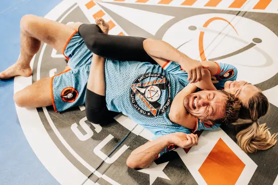 Training partners laughing mid-roll