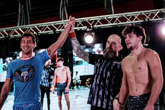 Coach Clay Wimer getting his hand raised at a no-gi tournament
