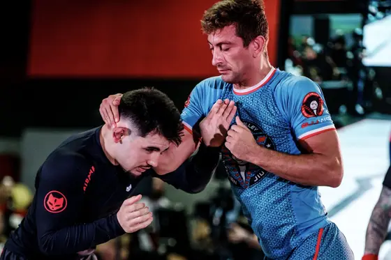 Coach Clay hand-fighting on the competition stage